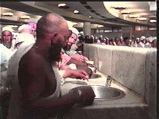 Pilgrims Quench thirst with Zam Zam